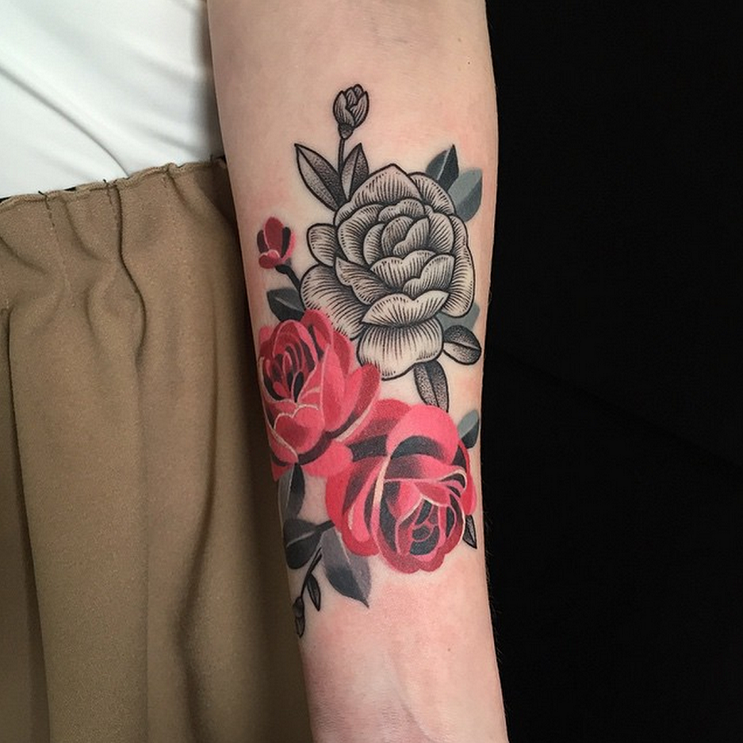 rose tattoos on man's arm