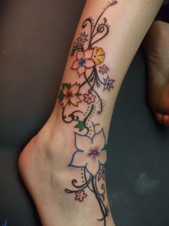 tattoo of woman with flowers