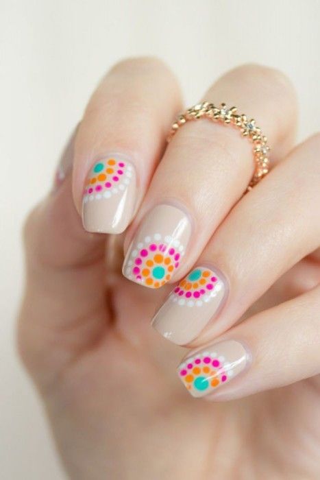 nails decorated with dots and flowers