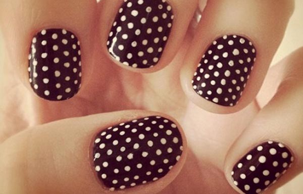 nails decorated with dots and stripes