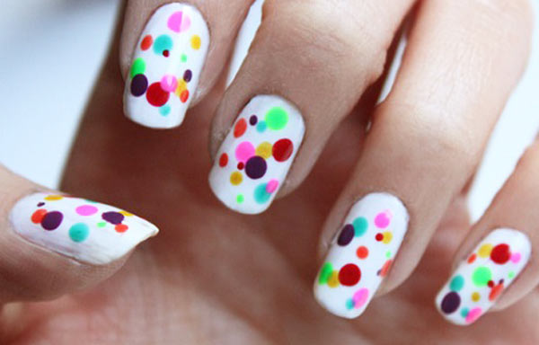 nails decorated with dots and stripes