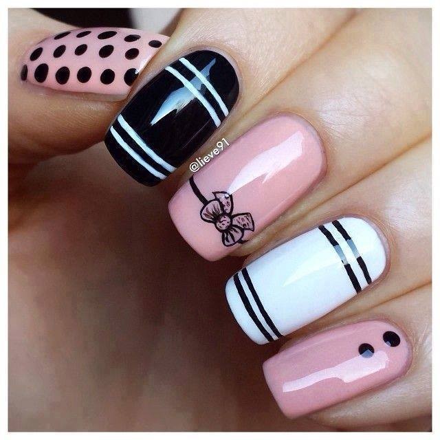 Nails decorated with dots and stripes