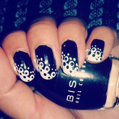 Black and white nail design with dots