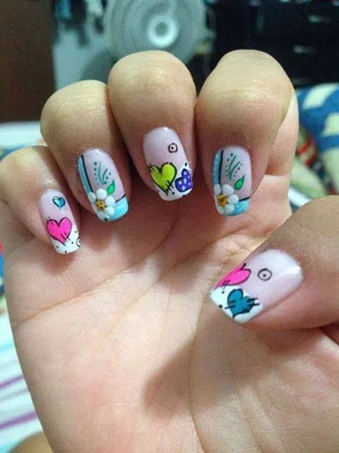 nails decorated with hearts and flowers