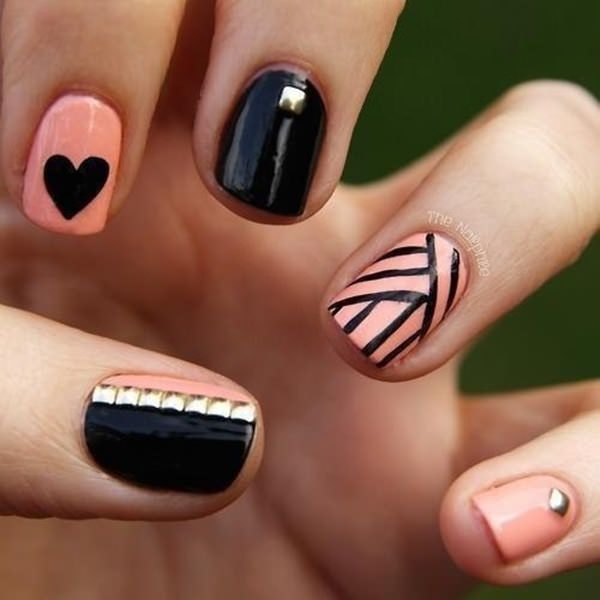 black and pink decorated nails