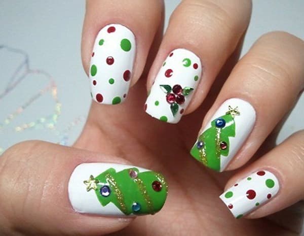 nail decorated for christmas with pine nuts