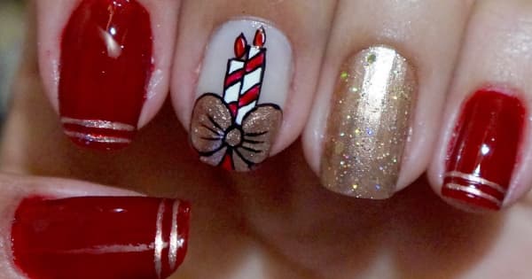 nails decorated for christmas with candles