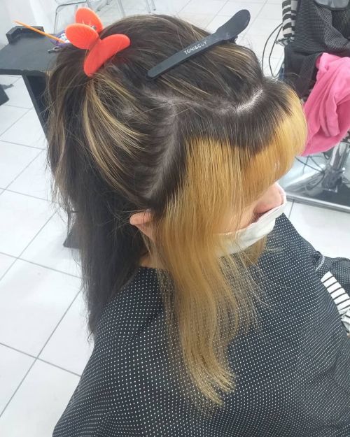 Woman with long hair updo with chunky highlights