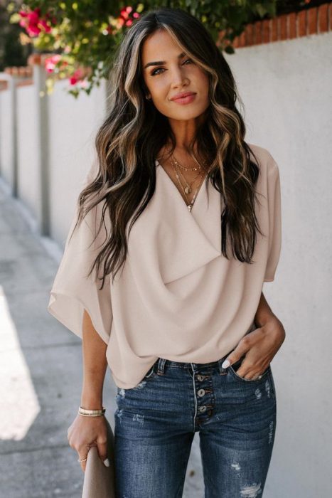 loose-fitting blouse with ripped jeans