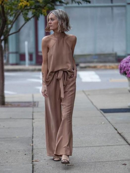loose-fit blouse with monochromatic dress pants