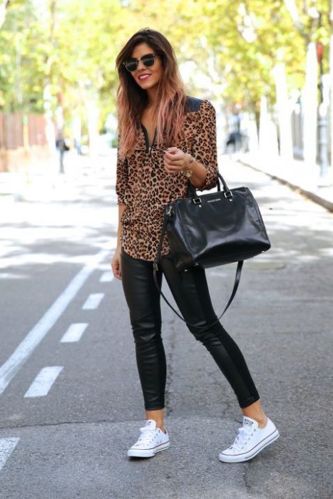 animal print blouse with black rubberized pants