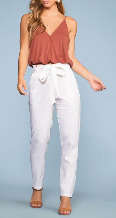 muscular blouse with white pants
