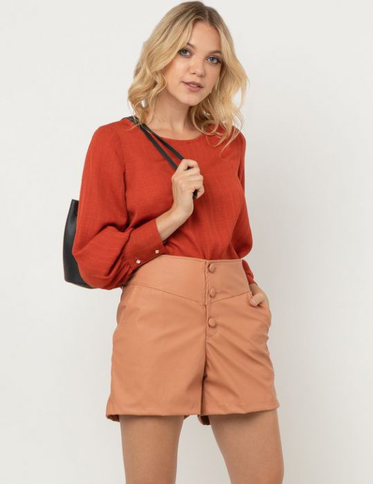 terracotta blouse and beige shorts