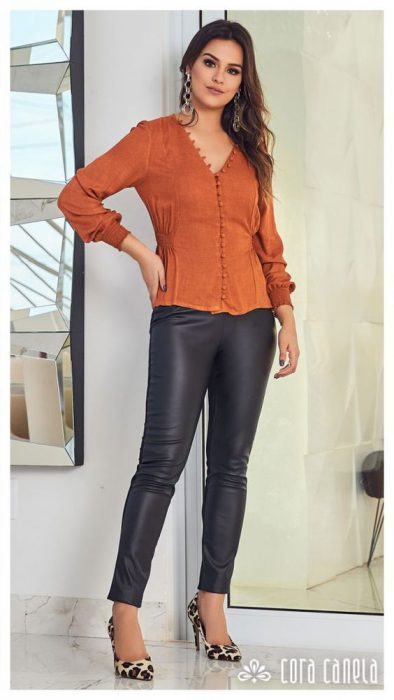 Terracotta blouse with black rubberized pants