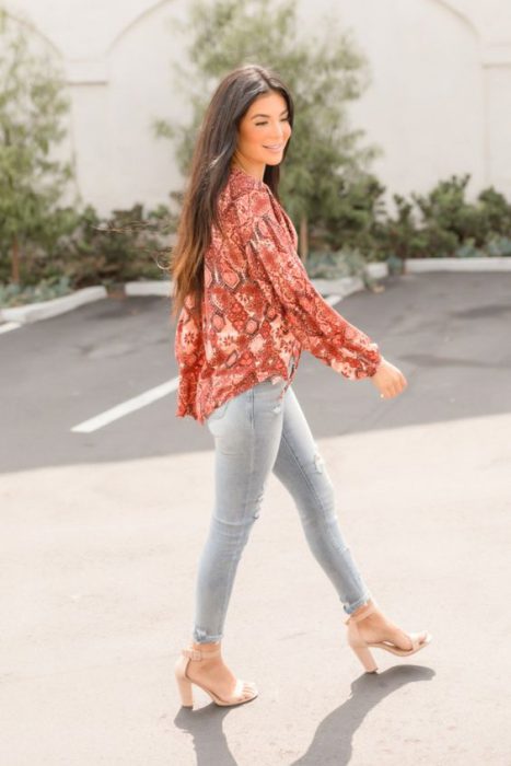 terracotta blouse with gray jeans