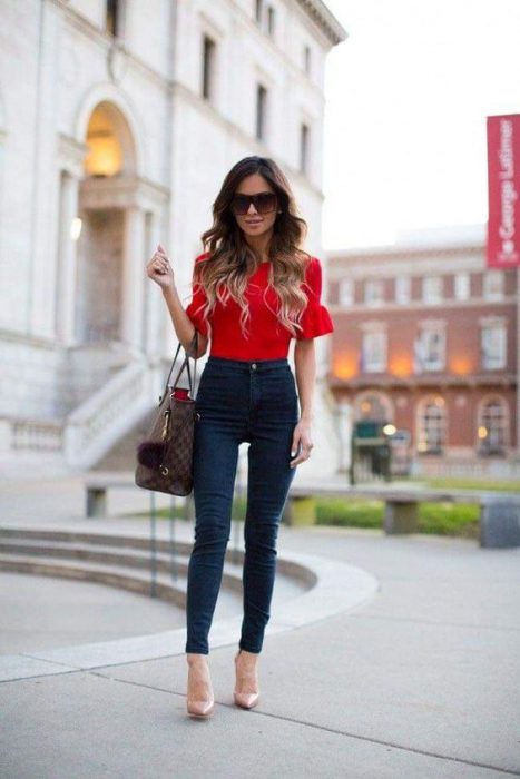 red blouse and high-waisted jeans