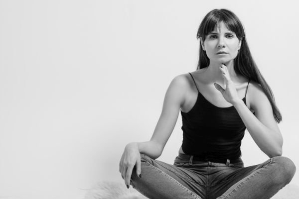 Yoga facial exercises woman holding chin 