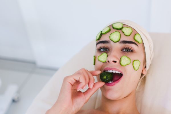 Cucumber woman on face 