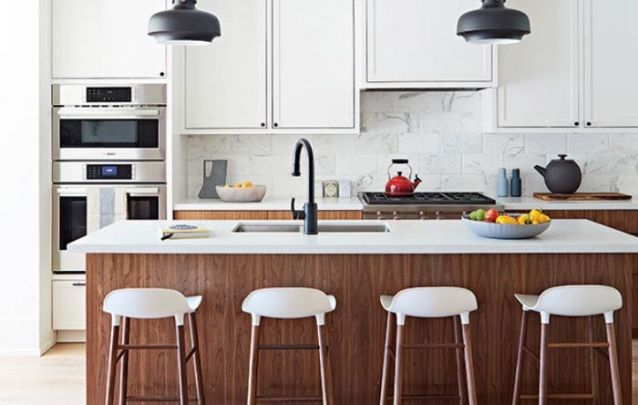 American kitchen with counter in the middle and white stools