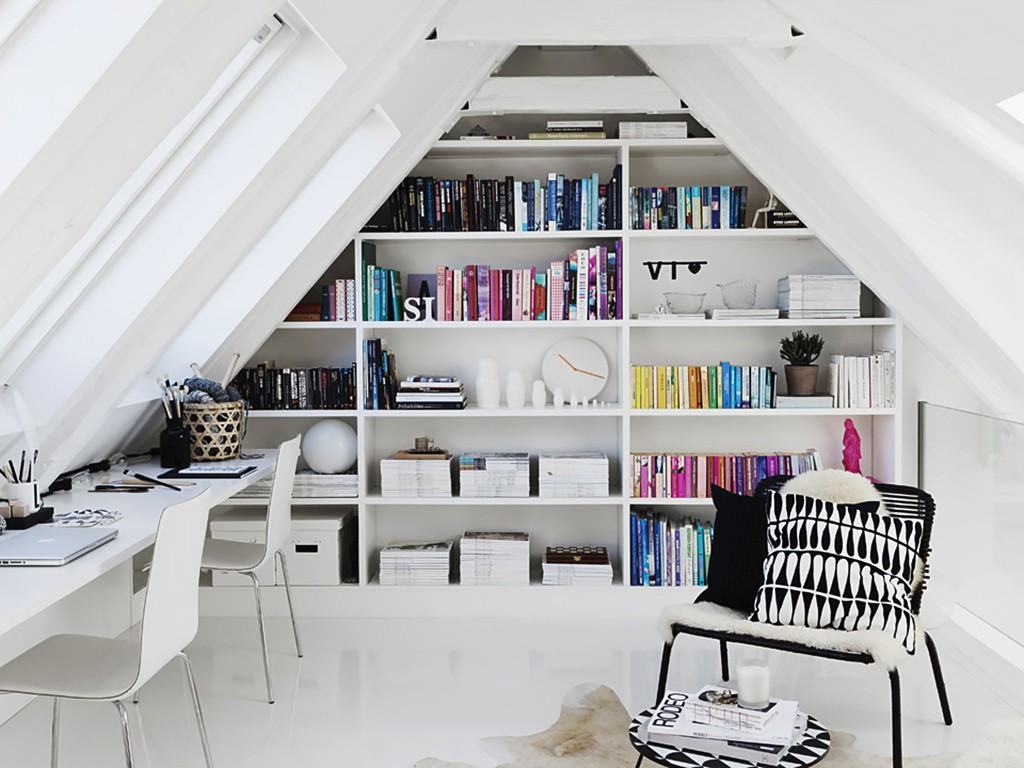 bedroom with bookcase on the wall in the loft