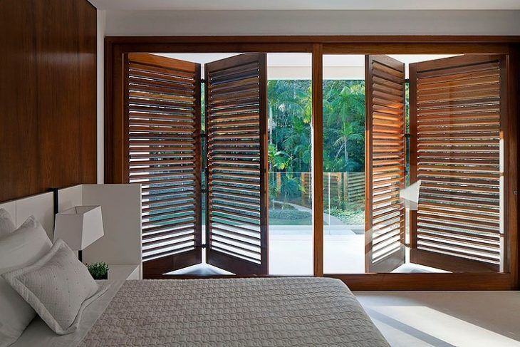 glass window door to bedroom with wooden sheets