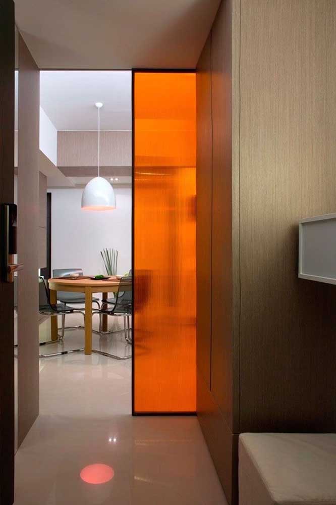 Smoked tempered glass door to the living room with lighting