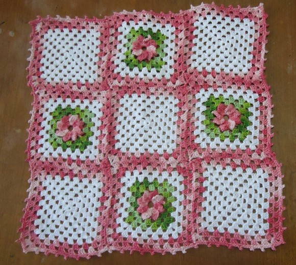 Square white and pink crochet towel