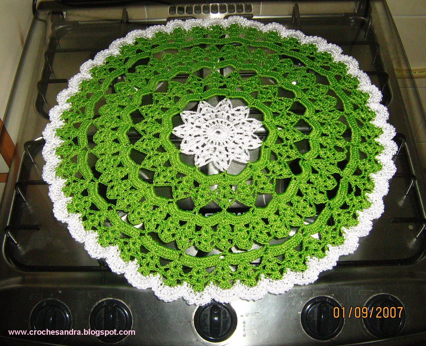 green and white crochet towel