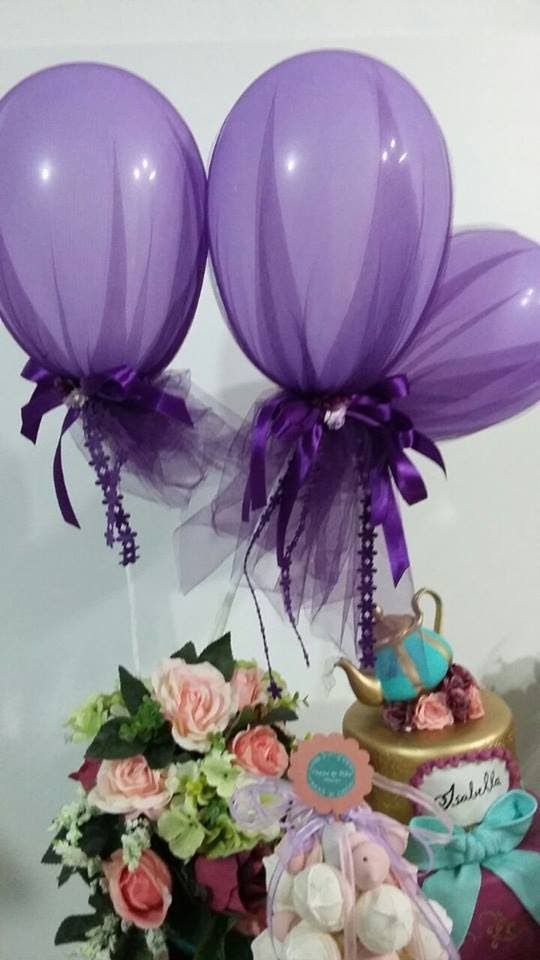 decoration with balloons and purple tulle