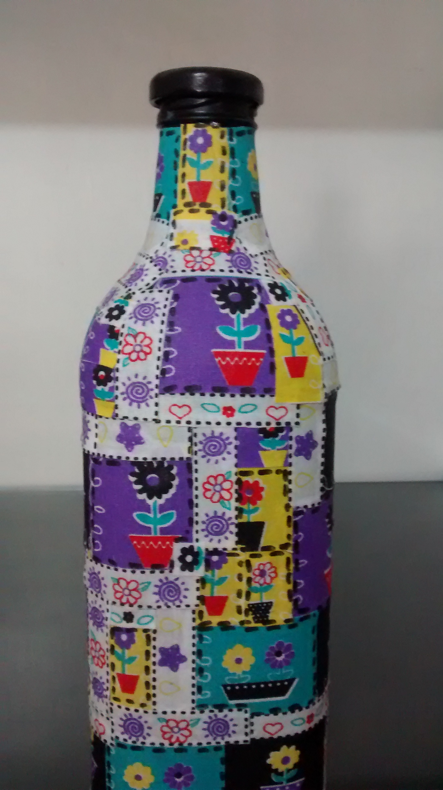 Bottles decorated with purple fabrics