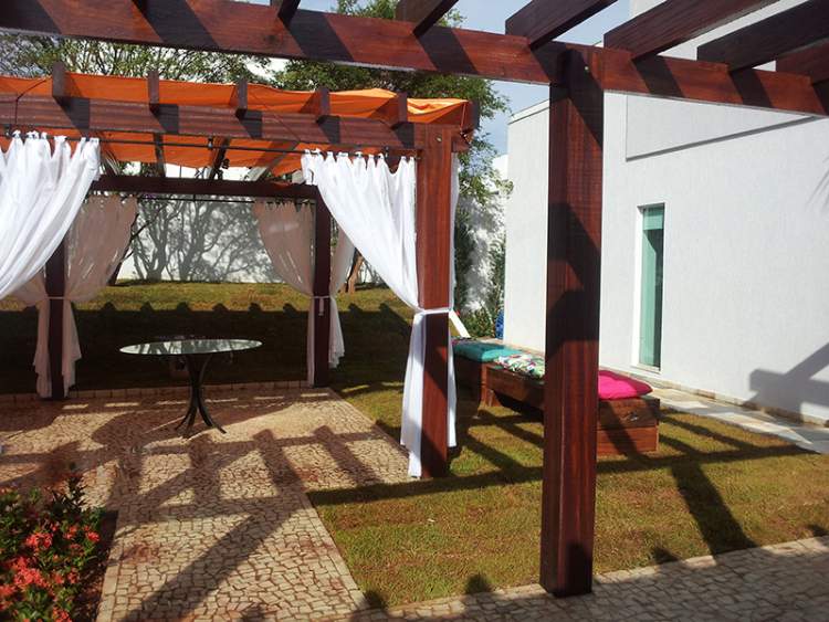 Pergola with white curtain