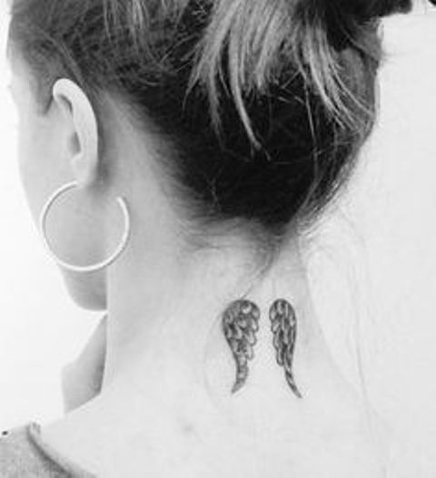 wings on neck - wing tattoos