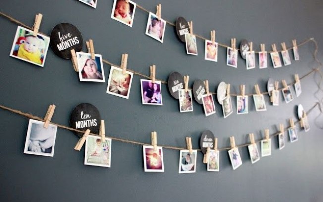 Children's birthday photo clothesline with gray background.