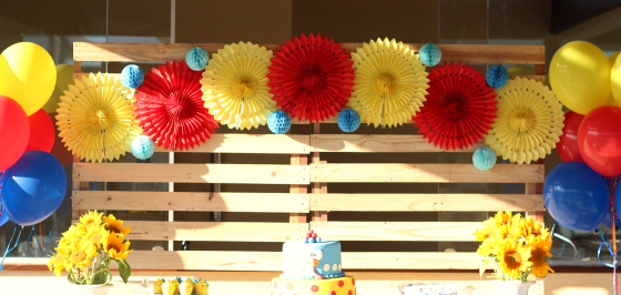 pallet panel with paper flowers and black and white background