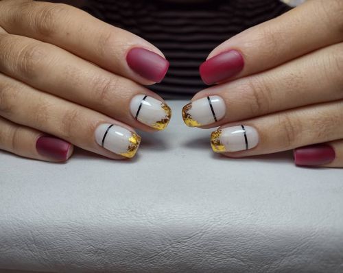 Red and white nails with gold and silver trim